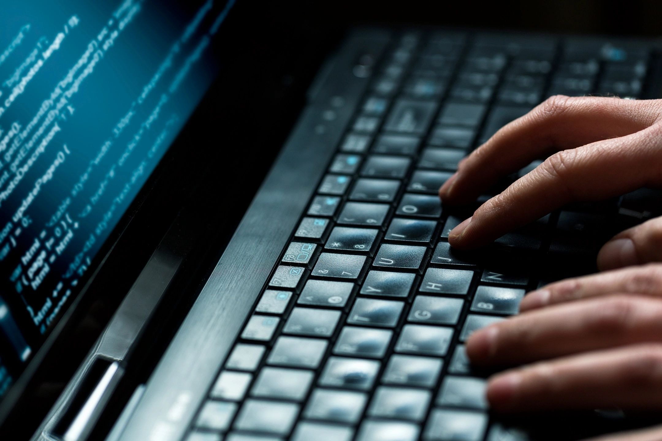 Person typing on laptop